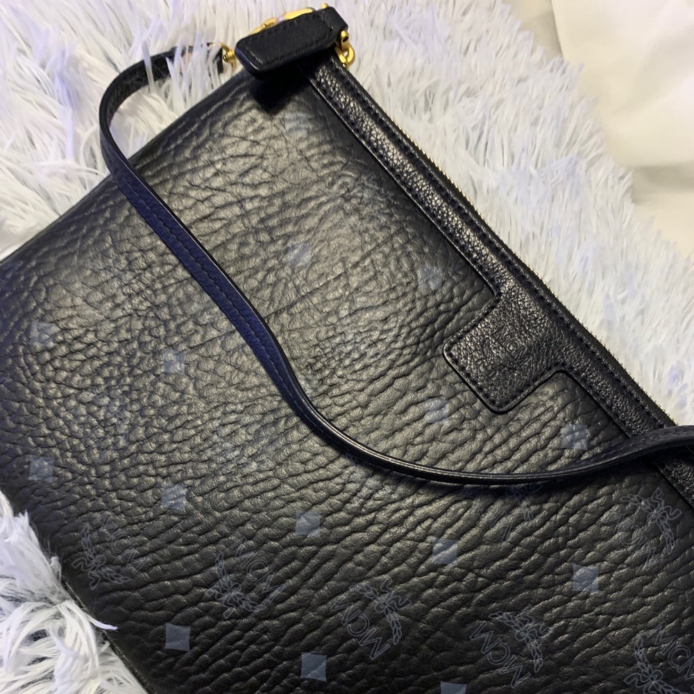 Never worn clutch that came with Duffel